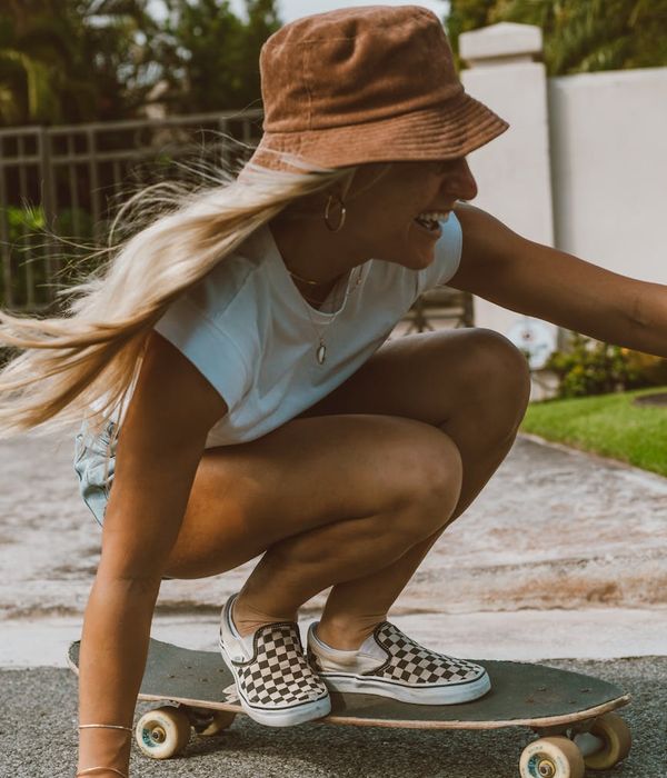 Woman feeling energetic and happy outdoors in the sun.